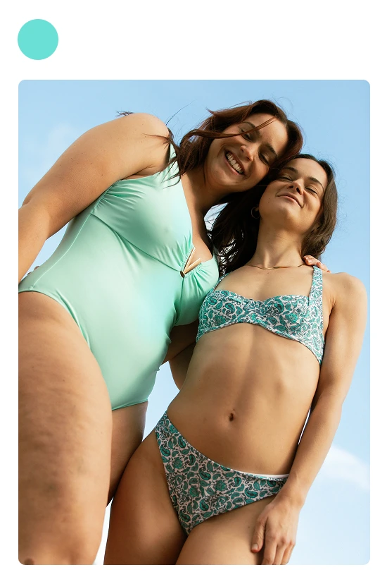 Two women in Aqva swimwear, cut out on the mint card
