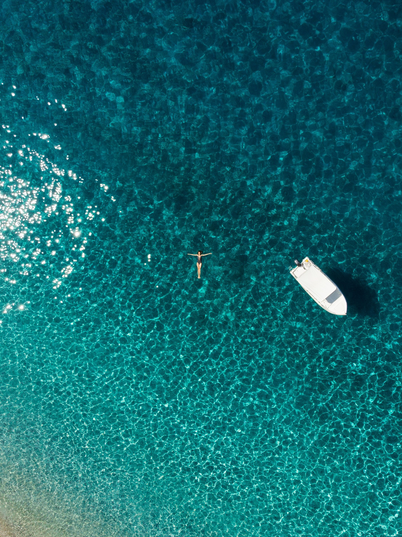 Aerial view of swimmers in turquoise water