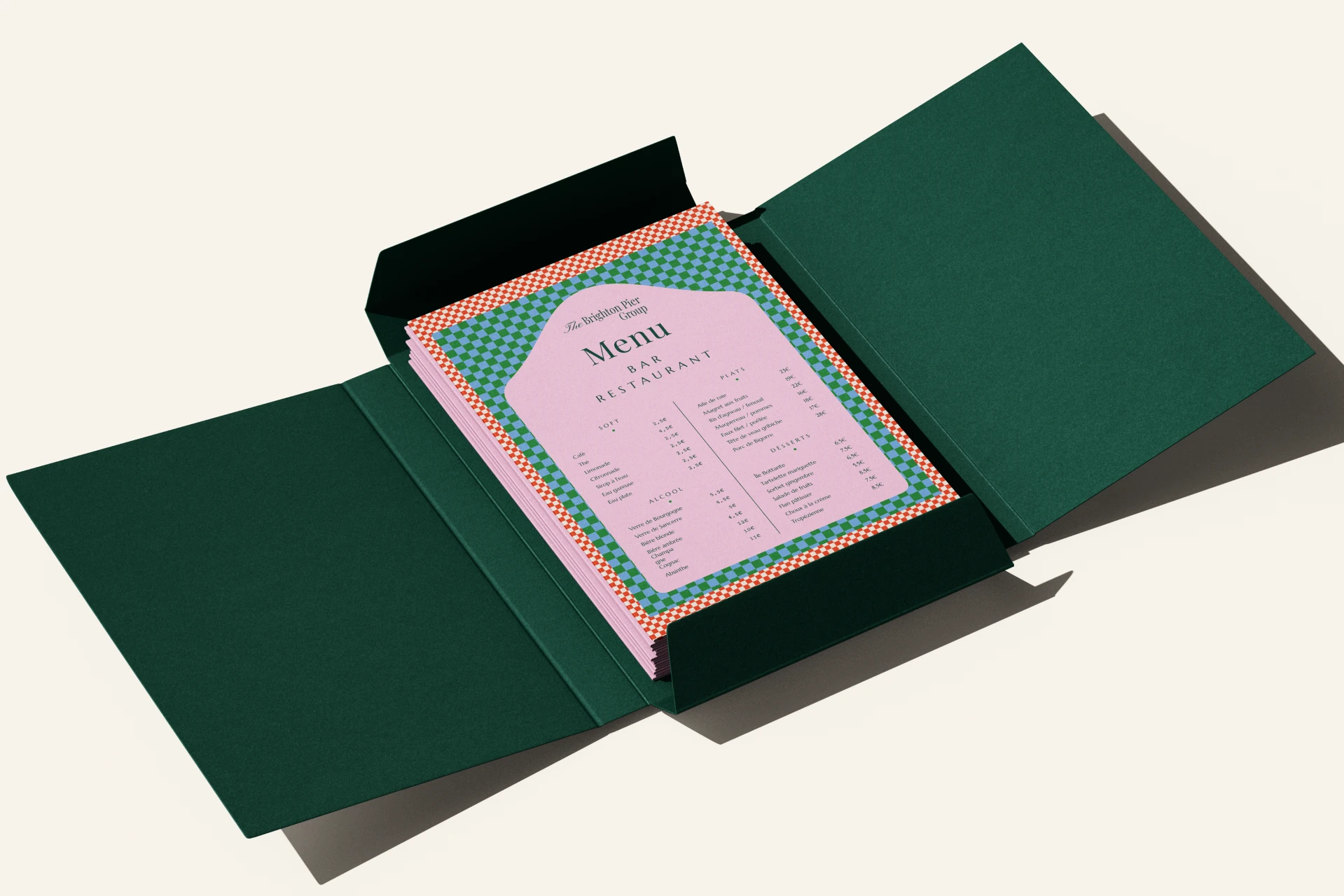 A pink chequer-bordered bar and restaurant menu inside a green presentation folder
