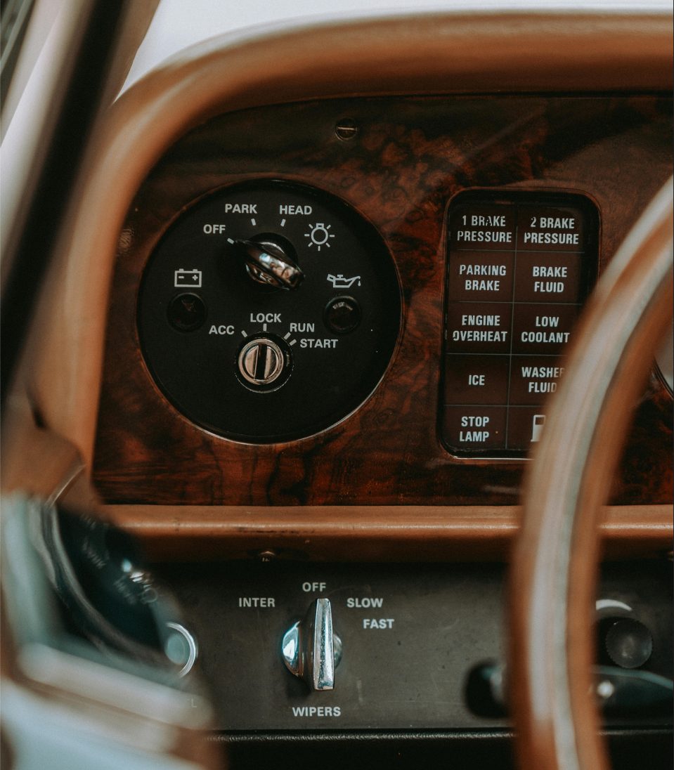 Classic car dashboard seen through the steering wheel