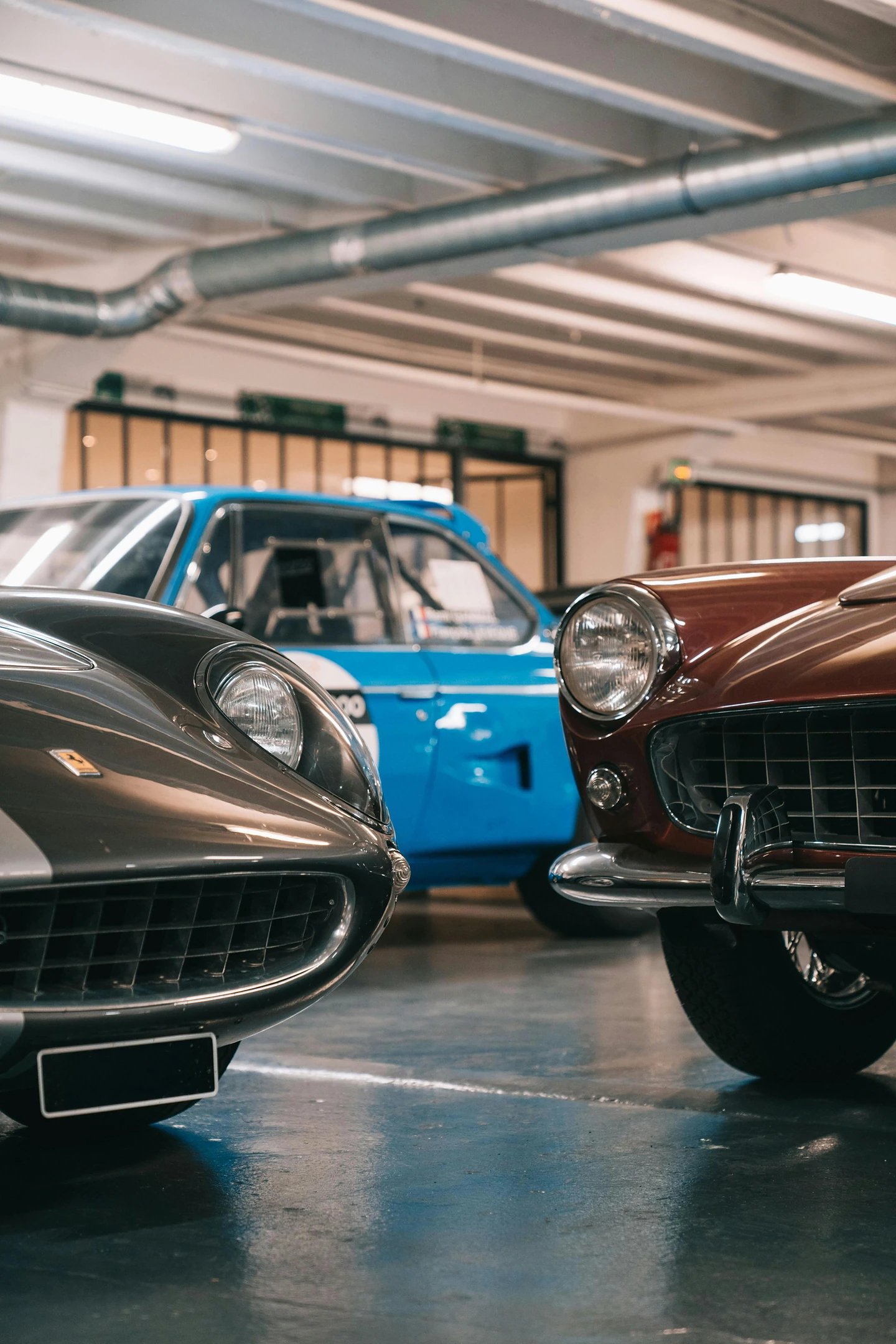 Classic cars lined up in the garage