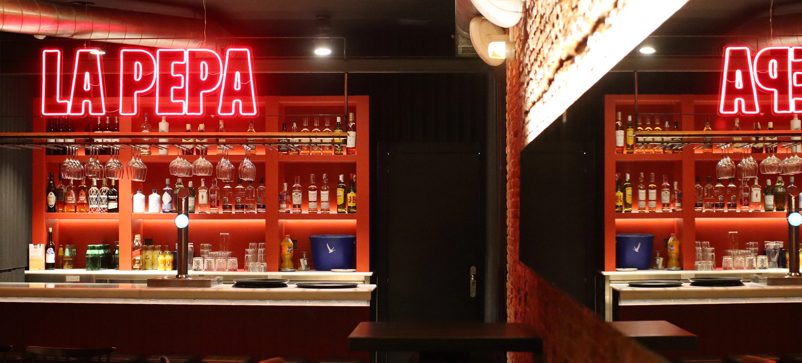 La Pepa restaurant interior with red banquettes