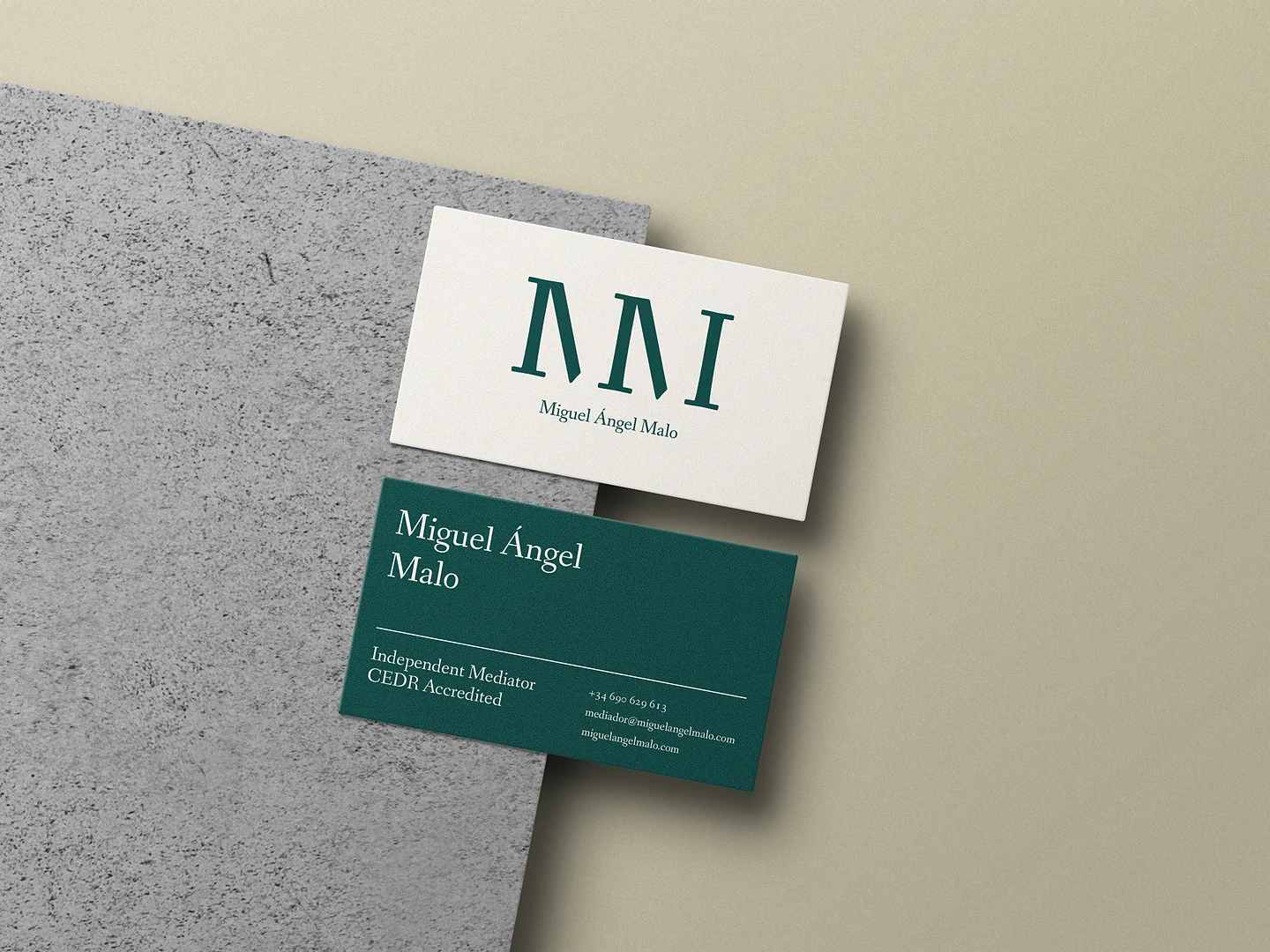Business cards in cream and forest green