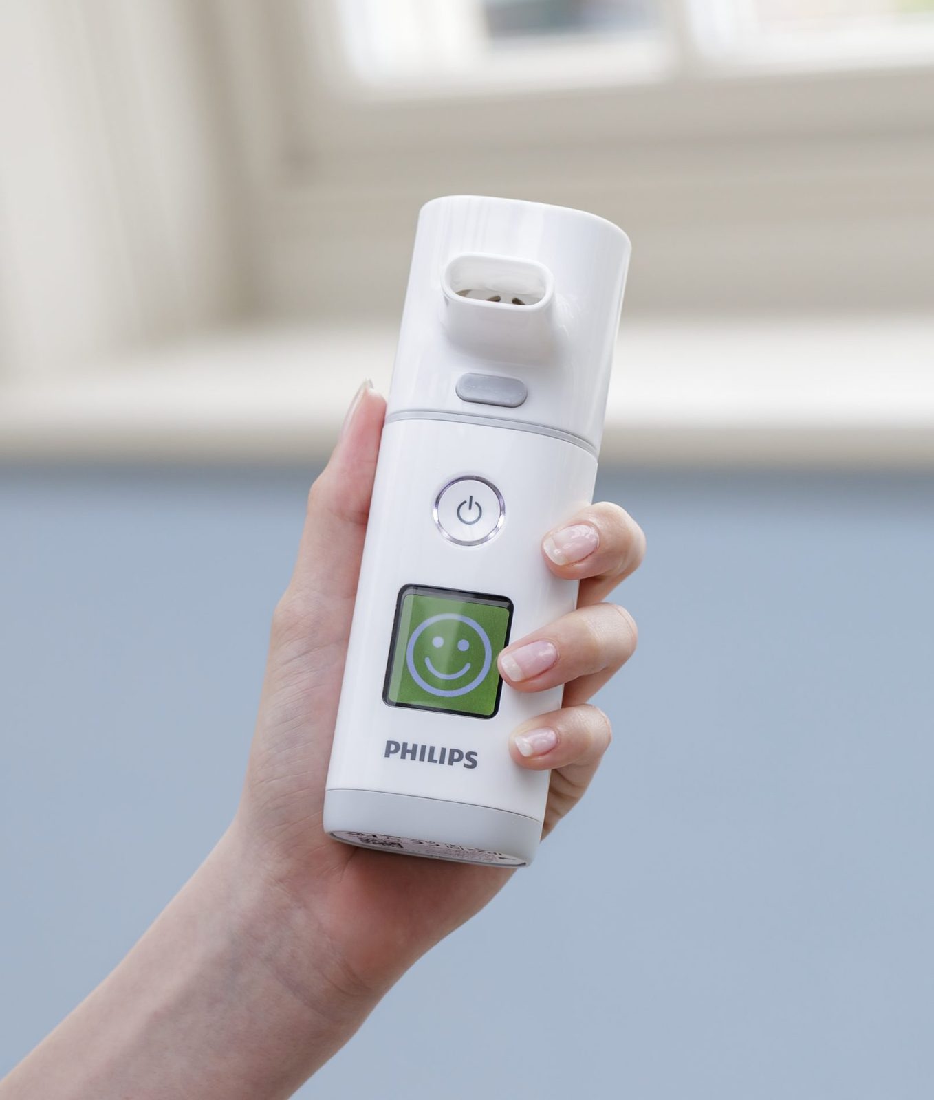 Hand holding the I-neb device