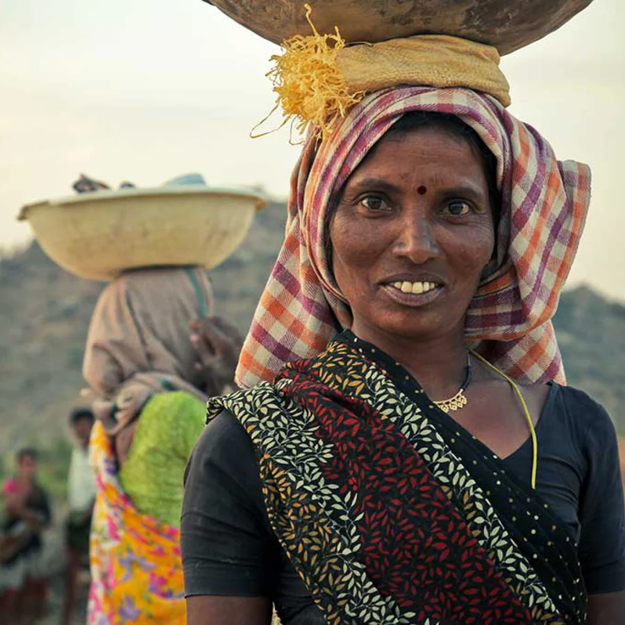 Farmer carrying harvested crops